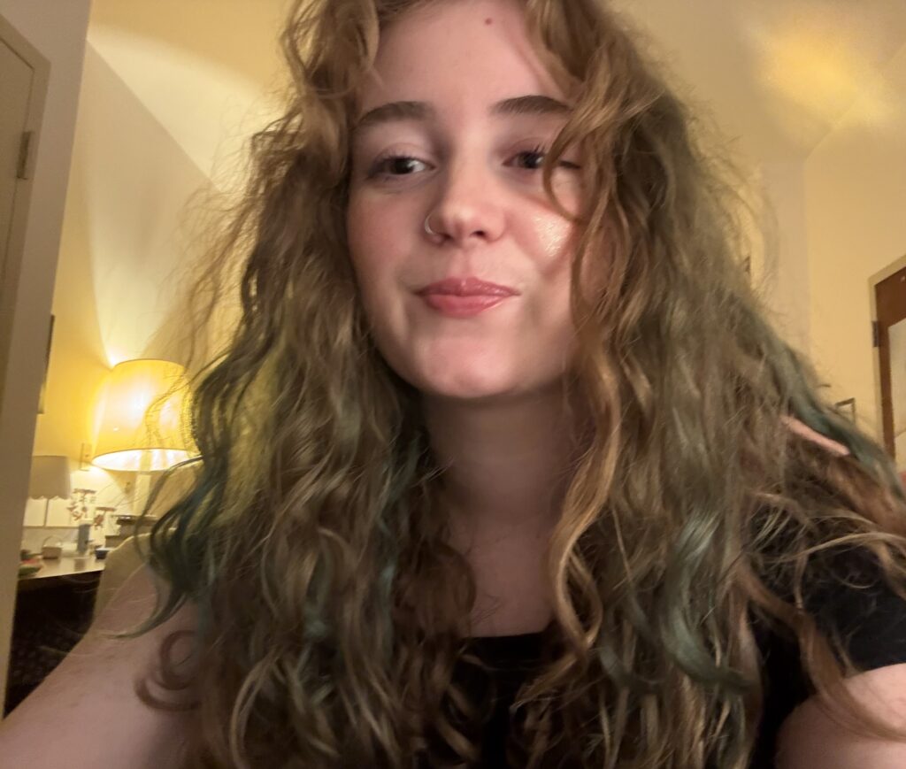 Selfie of Hannah in her room from a low angle